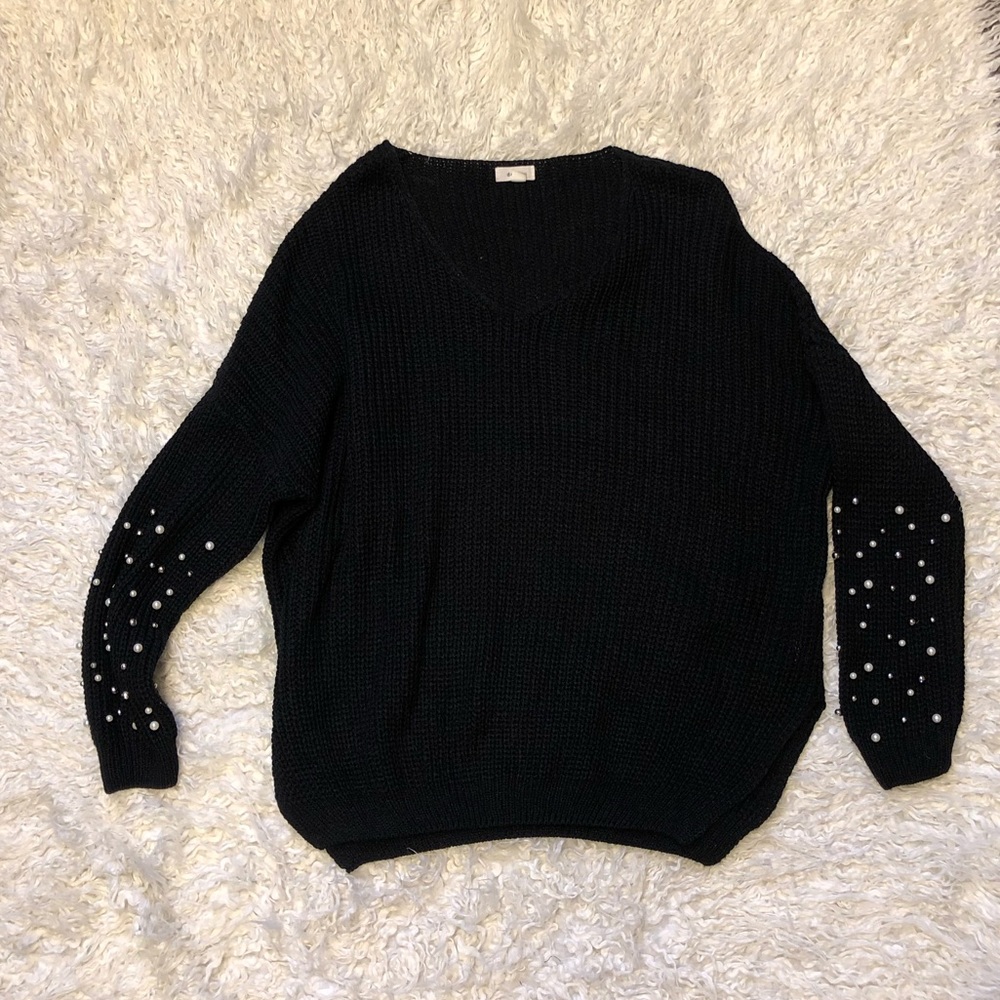 Black sweater with arm embellishment